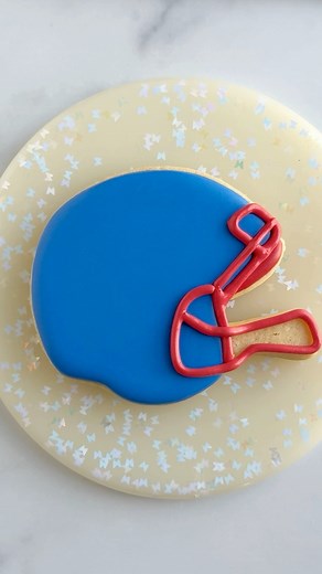 Are you excited about football season? I’m excited about this football helmet cookie! #royalicingcookies #decoratedcookies #footballhelmet #footballcookies #cookiedecorating #oddlysatisfying | Butterfly Bakes ATL