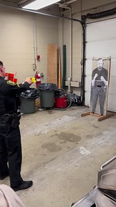 Sgt. Jeffrey Kilroy giving a taser demonstration for the residents of Linden Ponds during their police station tour this week. | Hingham Police