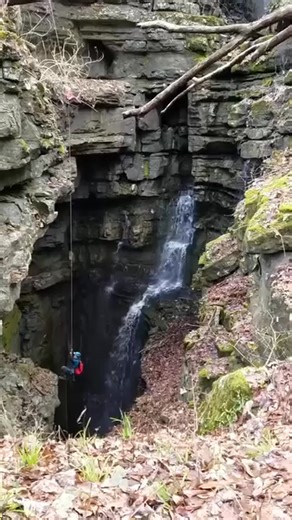 A beautiful waterfall plunges over 100 feet into this Tennessee pit. #tennessee #waterfall | TAG Caver