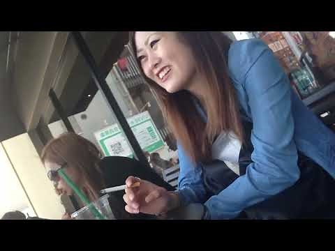 Japanese woman smokes a cork-tipped cigarette