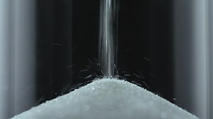 White sand falling inside an hourglass - Free Stock Video