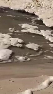 Watch: Amazing footage as sinkhole opens up on popular Qld beach