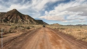 Desert dirt road trail recreation ATV POV Utah. Southwestern desert Utah, St George. Off road trail riding in 4x4 all terrain vehicle, sport and recreation. Red sandstone mountain adventure.