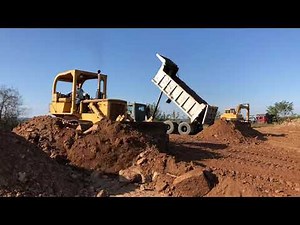 International TD15C dozer working the fill