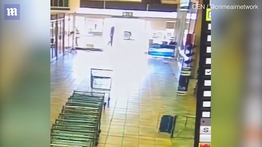 Shocking footage of security guard fighting off thugs in shootout