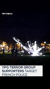 Supporters of YPG terror group target French police officers in Paris with mortar-style fireworks during a demonstration on January 21. | TRT World