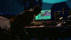 African american audio engineer uses compressor and mixer in professional studio | Premium Stock Video Footage