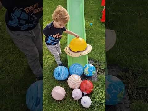 Justin plays with his inflatable planets! Learn about the solar system.