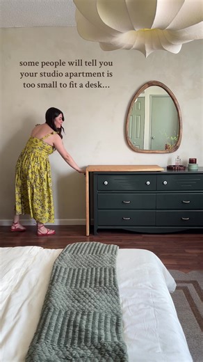 one of my favourite DIY's from this year has to be this dresser desktop from Elisha's studio makeover 🥲✨ we thrifted a dresser, and @handymangraham gave it a fresh coat of paint. He added this genius rolling desktop so Elisha not only had storage, but a surface to work and sew at 🤩 watch the full tutorial on Graham's channel if you're curious to see the full journey this dresser went through! #diy #upcycled #studioapartment