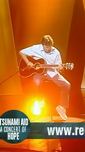 Eric playing a guitar solo alongside Roger Waters during a performance of "Wish You Were Here." The show occurred on this day in 2005 as part of 'Tsunami Aid: A Concert Of Hope,' as Eric and Roger filmed their contribution earlier in the day at BBC Studios in London. | Eric Clapton