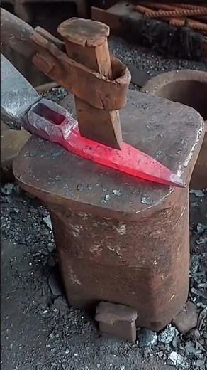 Traditional Blacksmith Hand Forging Glowing Red Hot Metal On Anvil