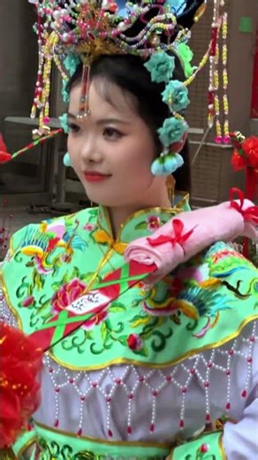 Flower Basket Parade: Traditional Female Dancers in Exquisite Costumes Showcase Oriental Elegance
