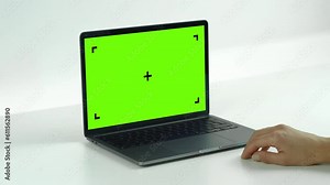Empty Green Screen Display Laptop Zoom Out on a White Background. Empty Green Mock-up Monitor for Video Call, Website Template Presentation or Game Applications. Blank Screen Monitor 3D render.