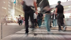 City, motion blur and people with rush for crossing road, safety perception and walking in street. Urban, legs and pedestrians in hurry for travel, commute and evening journey for tourists in Japan