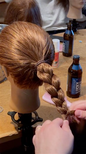 Teaching dads how to braid hair over beer