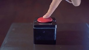 clip-1110260715-pressing-big-red-button-concept