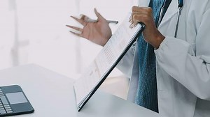 biochemical research scientist team working with microscope for coronavirus vaccine development in pharmaceutical research labolatory, selective focus