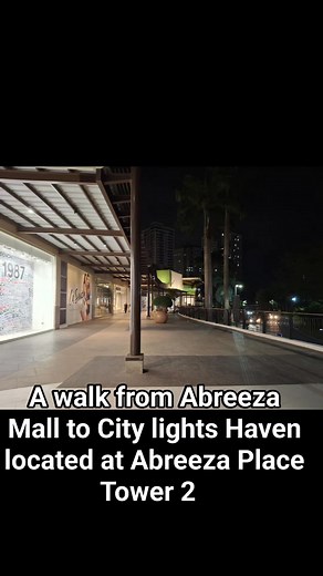 The walk from Abreeza Mall to Abreeza Place Tower 2 is a short and convenient journey, as the condominium is situated directly across from the mall on J.P. Laurel Avenue in Davao City. Exiting the mall, you'll cross the bustling avenue, where you'll see the modern facade of Abreeza Place Tower 2, a prominent residential building in the area. The proximity of these two landmarks offers residents and visitors easy access to shopping, dining, and entertainment options within the mall, enhancing the