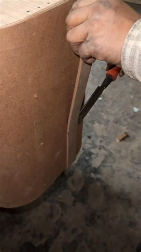 “Hand Trimming the Curved MDF Panel”...