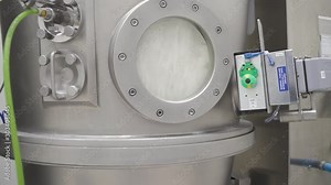 Modern pharmaceutical machine for mixing drug granules and powder liquid. equipment in the laboratory. Medicine industry. factory manufacturing container