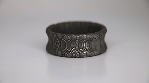 In this video, I made a Damascus Steel ring from Vegas Forge's Reptilian Damascus Steel. Damascus Steel is created by forging multiple types of steel together to form a wood grain like pattern. This ring is particularly unique because of the inverted profile. What are your thoughts on this inverted look? Do you think I should sell these in the normal rounded profile as well? | Patrick Adair Designs