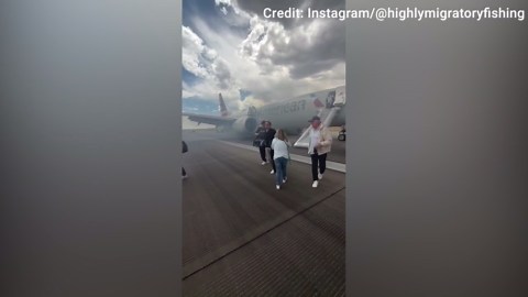 Passengers evacuate American Airlines aircraft after landing gear issue at Denver airport