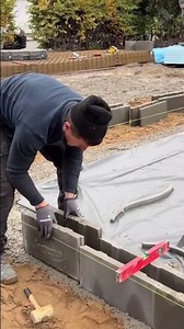 The process of installing concrete bricks to make walls #shorts