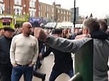 Disgruntled Millwall fan decks singing Tottenham fan