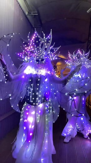 Angelic Dance Performance with Glowing Costumes