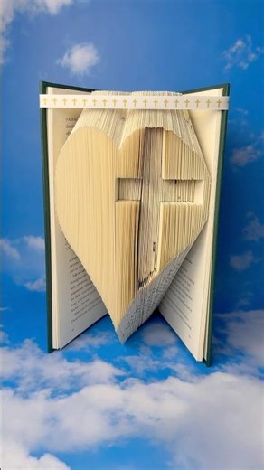 Putting a cross inside a heart book folding art #bookart #bookfolding #christianart