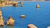 Ponta da Piedade is a unique rock formation with famous grottos in...