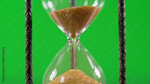 hourglass on green ack background