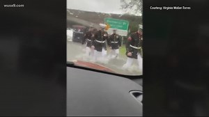 Marines help stranded woman after car becomes stuck in floodwater