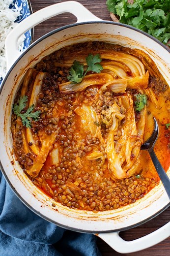 This Braised Cabbage & Lentils recipe is perfection! Napa cabbage is cooked in a coconut curry sauce with lentils until super tender! #thissavoryvegan #cabbage #lentils #eatyourveggies #veggielover #veganentree | This Savory Vegan