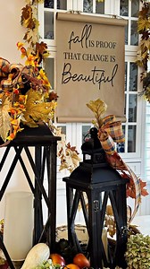 I love crafting cozy and welcoming fall vignettes, and this one truly captures the essence of the season. Imagine a charming woven tray, beautifully adorned with lanterns holding flickering candles, casting a warm and inviting glow. Surrounding them are rich fall leaves, sprigs of faux bittersweet, and dried hydrangea blossoms, adding a touch of elegance and texture. Faux gourds and pods nestle among the arrangements, bringing in the natural beauty of the harvest season. Fall ribbons add a delic