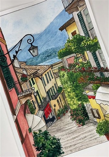 Painting this beautiful street in Italy I love the vibrant coloures and blooming balconies🌿🎨✨What do you think? #watercolor#watercolorpainting#linedrawing#artontiktok#art#artist#lakecomo#bellagio#painting#detail#street#italy#aestheticart