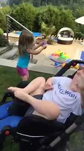 My watering buddy.... It is a simple summertime pleasure-getting in a pool, playing on a swing set, running through the sprinkler. But all of those relaxing, fun things for other kids often just aren't an option for Bennett. The reasons sometimes seem endless-It's too hot outside. His seizure medication makes him photo sensitive. The reflection on the pool is harsh. He doesn't like feeling the water. It takes at least two people to safely get him in and then manage him in a pool (and I'm by myse