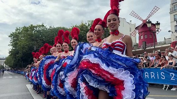Can-can dancers perform in front of Moulin Rouge for Olympic cycling