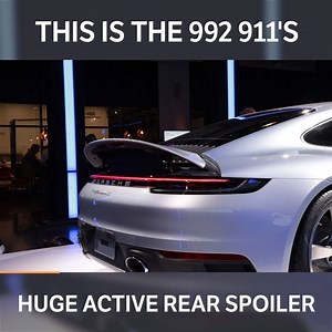Here's a closer look at the new active spoiler on the 992 Porsche 911! It's much wider than the 991's, spanning almost the entire width of the rear. When deployed, it gives the 992 a 959-esque back end, don't you think? | Car Throttle