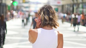 Beautiful young woman smiling in the street, A pretty woman happy in a sunny day, smiling and in a positive attitude