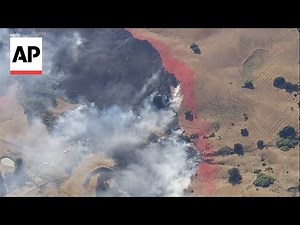 Firefighters battle wildfires in southern and central California