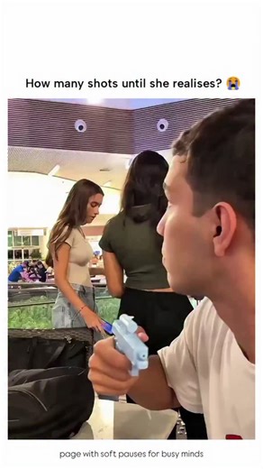 Soft Pause | She knew it.. The video shows a young man in a busy mall atrium holding a colorful water gun, standing close to a woman who appears to be... | Instagram