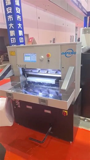 Paper cutting machine with loader and unloader