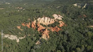Aerial footage of Red sands and abstract Rustrel canyon moher cliffs landscape. Provencal Colorado near Roussillon,in the Vaucluse department - Southern France.
