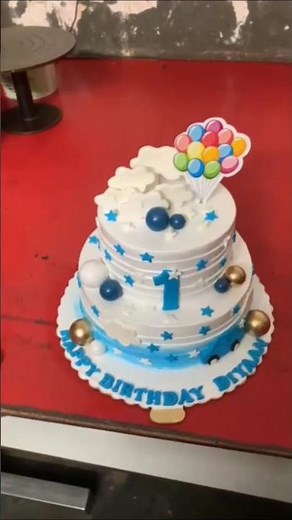 blue and white cake with balls and Star and clouds