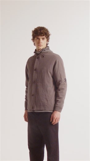 The evolution of knitwear, engineered for modular layering. Two garment-dyed cotton jumpers lead the season: one fully reversible with a nylon interior, the other completed by a detachable multi-pocket Chrome-R vest. Discover Spring/Summer 026 at cpcompany.com and flagship stores. | C.P. COMPANY