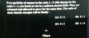 Two particles ef manues in che ratio 1: 2 with chargs in the... | Filo