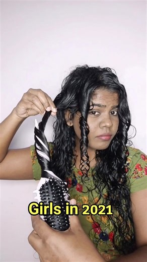 Happy Curls on Instagram: "Girls in 2021 VS 2026 👉Many curlies want defined, long-lasting curls, so they choose brush coiling (I did too in my early CGM days). But it’s very time consuming. 👉Instead, try brush styling with tension, it gives definition and lasts long in just 10 minutes. Save this for future use For more do follow @that_noodlehead Curls, curly hair, girls, girls in 2021, girls in 2026, how girls style their hair, how to style curly hair, how to style wavy hair, wavy hair, finger