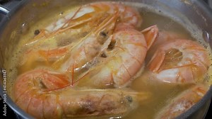 Cooking Huge Prawns, Seafood. Boil Large Prawns in a Saucepan. Healthy Sea Food. The Shrimps are Cooked and Boiled.