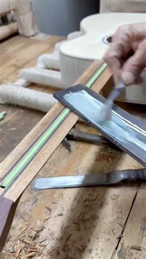 The installation procedures for the guitar fingerboard and truss rod.